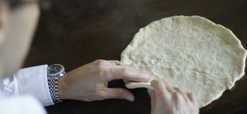 shaping-pizza-dough